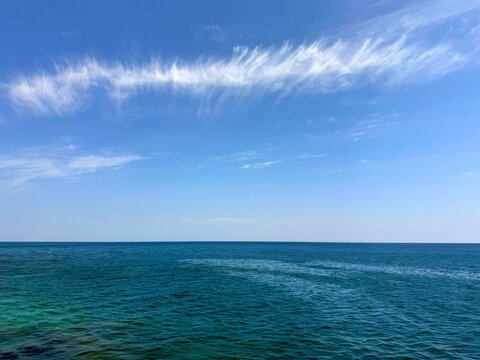 Open sea and blue sky with beautiful clouds.