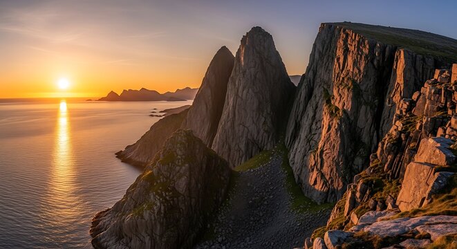 Dramatic Sunset Over Segla Mountain Peaks in Norway.