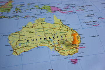 Fototapeta premium Map pin pointing to Canberra, Australia, symbolizing capital city location, navigation, travel planning, geography, and national government center