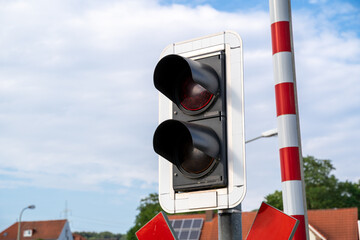 Railway crossing traffic light with red signal