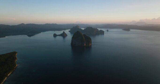 Tropical Islands with sandy beach at dusk time. El Nido. Palawan, Philippines.