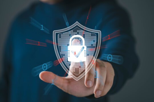 Cyber security and data protection concept with human hand touching digital shield and lock icon, binary code, secure network, privacy protection, information safety, modern technology defense system.