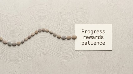 Minimalist photo of stones representing progress and patience