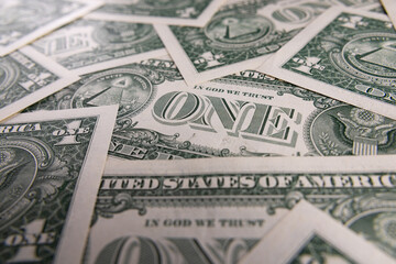Background Pattern of Scattered One US Dollar Bills Showing Reverse Side Symbols