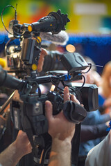 Professional Video Camera Operator Filming Live Event with Copy Space for Media Concept