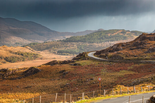 The MacGillycuddy&rsquo;s Reeks and the Ring of Kerry N71 road seen from Moll&rsquo;s Gap, a mountain pass in Killarney National Park, Ireland