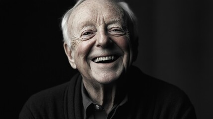 Fototapeta premium Portrait of a senior man, joyfully smiling. He appears happy and content