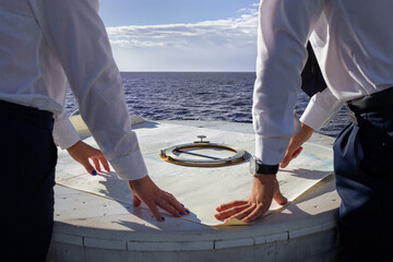 Nautical chart compass center, captains sea exploration, voyage preparation atmosphere, blue sky horizon, nautical lifestyle © Travel Studio Stock