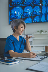 Female Doctor Reviewing Brain MRI Scan in Medical Office