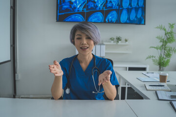 Female Doctor Speaking and Gesturing in Telehealth Video Call