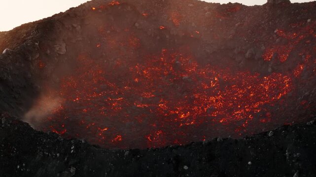 Aerial view of glowing lava lake inside Fuego volcano crater in Guatemala.