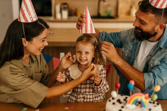 Children celebrating an occasion at home with sweets