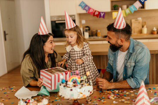 Family enjoying a special day receiving presents