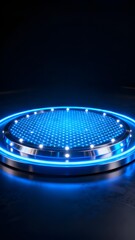 Circular illuminated platform with blue LED lights on a dark surface