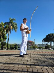 homem tocando birimbau musica de capoeira  © Alexandre