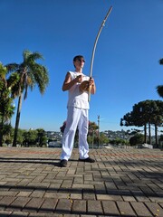 homem tocando birimbau musica de capoeira  © Alexandre