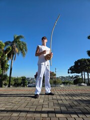 homem tocando birimbau musica de capoeira  © Alexandre