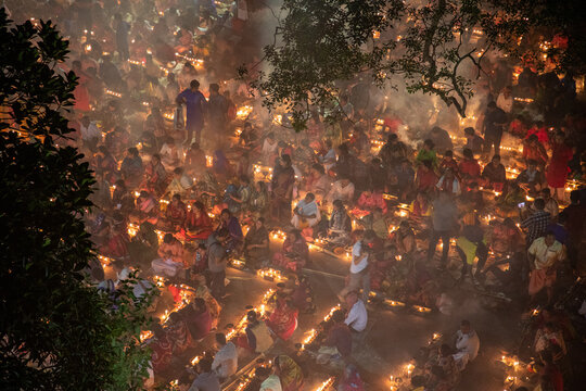 Aerial view of countless lights glow warmly amidst a dense gathering of people, casting a soft, ethereal radiance over the scene, Narayanganj, Dhaka Division, Bangladesh.