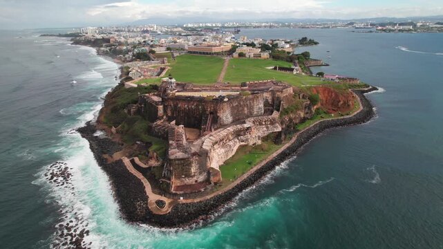Epic cinematic aerial of Castillo San Felipe Fortress and Park in Old San Juan, Puerto Rico, 4K