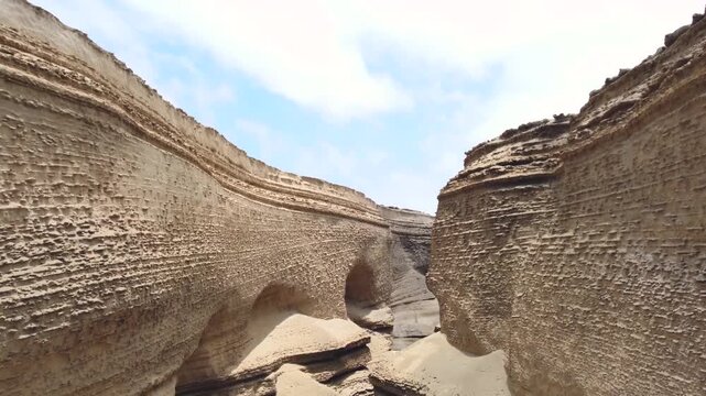 Drone aerial view,Ca&ntilde;on del Zapa (known as The Canyon of the Lost) is located, in the area called Montegrande, in Ica Peru, blue sky 4K
