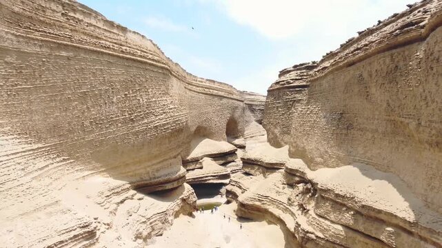 Drone aerial view,Ca&ntilde;on del Zapa (known as The Canyon of the Lost) is located, in the area called Montegrande, in Ica Peru, blue sky 4K