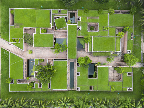 Gaibandha, Bangladesh - 21 June 2025: Aerial view of meticulously designed green spaces blending with structured architecture, creating a vibrant tapestry from above.