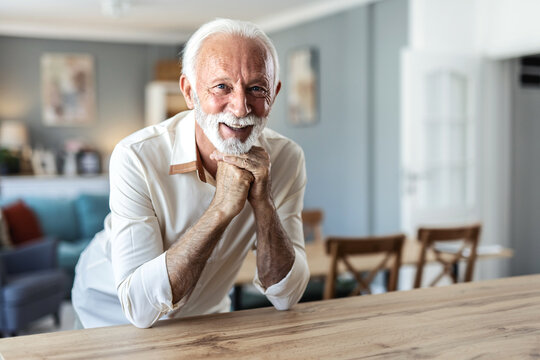 Smile, portrait and senior man alone in retirement. Relax, retired and elderly happy male in house, thinking and happiness with lifestyle, confidence and positive mindset.