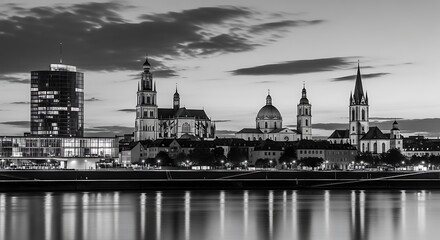 Fototapeta premium Cityscape with historic churches and modern building reflected in water.