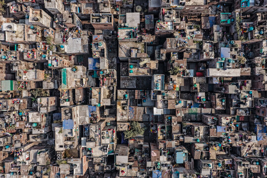 Aerial view of tightly packed buildings with varied textures and colors create a dense urban tapestry, Dhaka, Dhaka Division, Bangladesh.