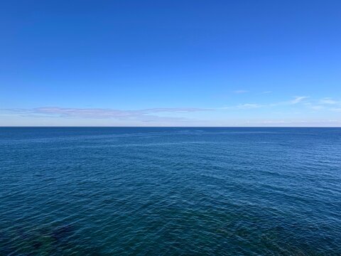 Calm blue ocean water and sky.