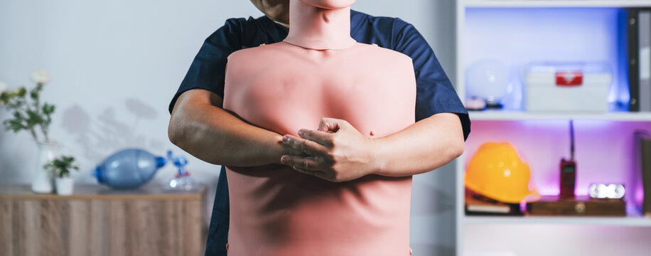 Emergency First Aid Banner Highlighting Professional Heimlich Maneuver And Choking Rescue Procedures On Training Dummy For Healthcare Safety Preparedness