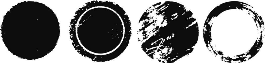 set of four black grunge circles distressed round shapes with rough, textured edges in vector