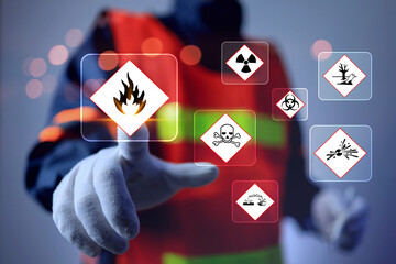 materials safety data sheet MSDS concept with safety staff pointing on flammable warning sign virtual interface represents working on dangerous substances hazardous warning information