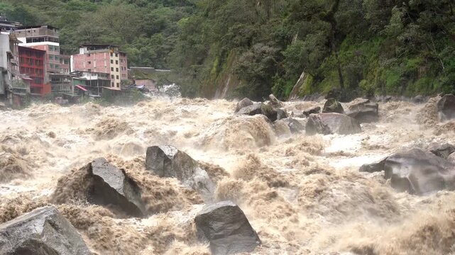Scenic dramatic view with the powerful waters of Urubamba River crossing the Sacred Valley in Aguas Calientes
