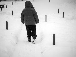 man stepping on the snow,