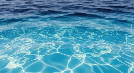 Obraz premium Clear blue water surface with sunlight reflections and ripples