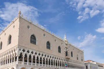 Ornate gothic facade of Doge Palace in Venice under blue sky