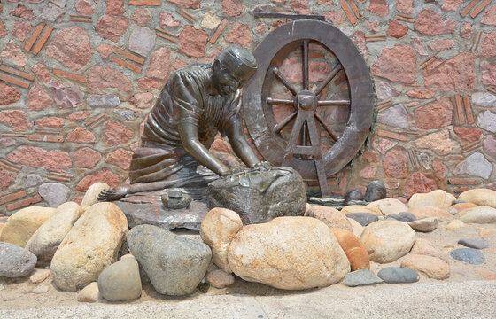PUERTO VALLARTA MEXICO:  Washer Woman bronze statue by Jim Demetro, placed in 2008 near the Cuale River bridge and in front of the Molino de Agua condos along the malecon boardwalk 