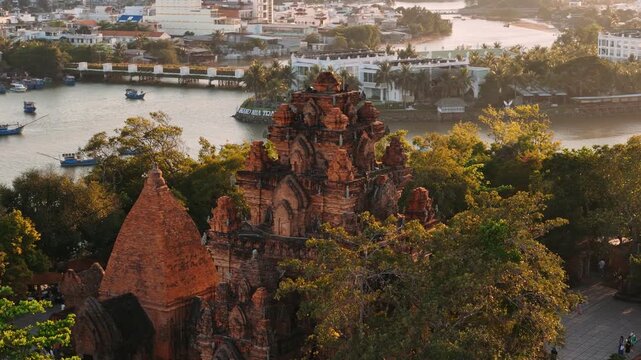Aerial view of po nagar cham towers in nha trang, vietnam at sunset and city skyline in the background