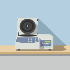 Fototapeta premium A laboratory centrifuge with its lid open, displaying its rotor and control panel.