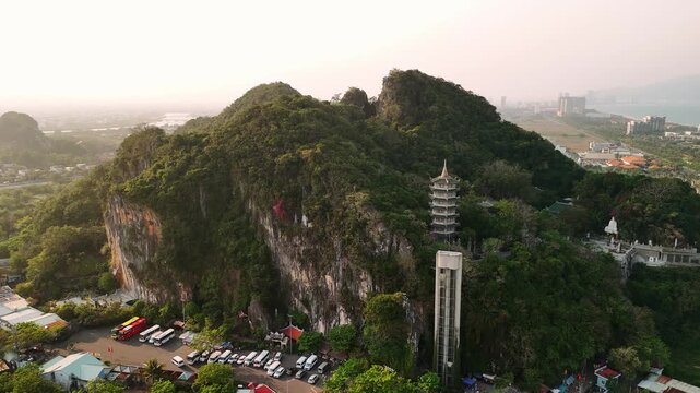 Aerial view of marble mountains pagoda in da nang, vietnam with cityscape in the background