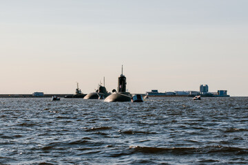 Obraz premium View from the water of nuclear submarines in the waters of the Gulf of Finland.Preparation for the military parade on the Day of the Navy in Kronstadt.A missile submarine