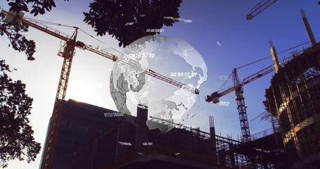 Floating digital globe overlay hovering above city construction site, with tower cranes, rebar