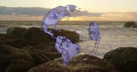 Naklejka premium Floating faint purple hatched globe hovering above rocky shoreline at sunset, with pools and waves