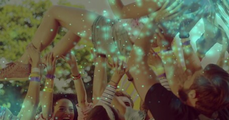 Lifting person wearing denim shorts and light top above park, showing pink sneaker and wristbands