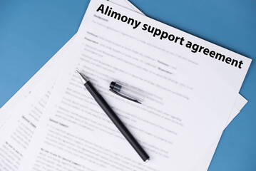 Obraz premium Alimony support agreement document on desk, legal paperwork for divorce settlement, family law and financial support concept.