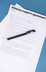 Fototapeta premium Alimony support agreement document on desk, legal paperwork for divorce settlement, family law and financial support concept.