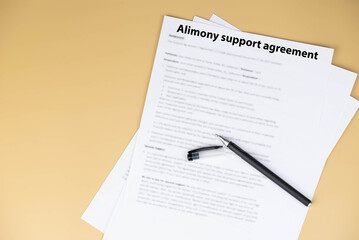 Obraz premium Alimony support agreement document on desk, legal paperwork for divorce settlement, family law and financial support concept.