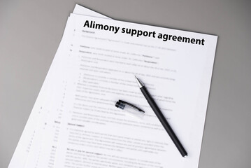 Obraz premium Alimony support agreement document on desk, legal paperwork for divorce settlement, family law and financial support concept.