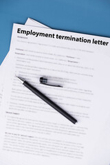 Employment termination letter on office desk, official HR document about job dismissal and career transition, symbol of workplace decision, stress, and change in professional life.